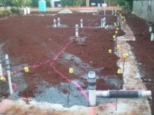 Pouring of the footing showing plumbing drains